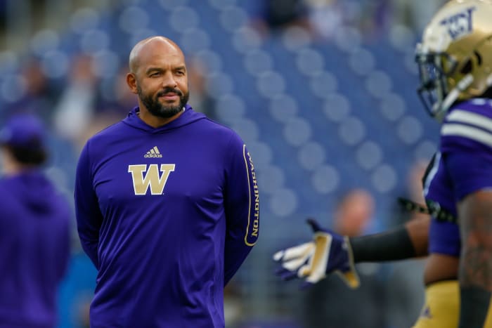 Oct 16, 2021; Seattle, Washington, USA; Washington Huskies head coach Jimmy Lake watches pregame warmups against the UCLA Bruins at Alaska Airlines Field at Husky Stadium.